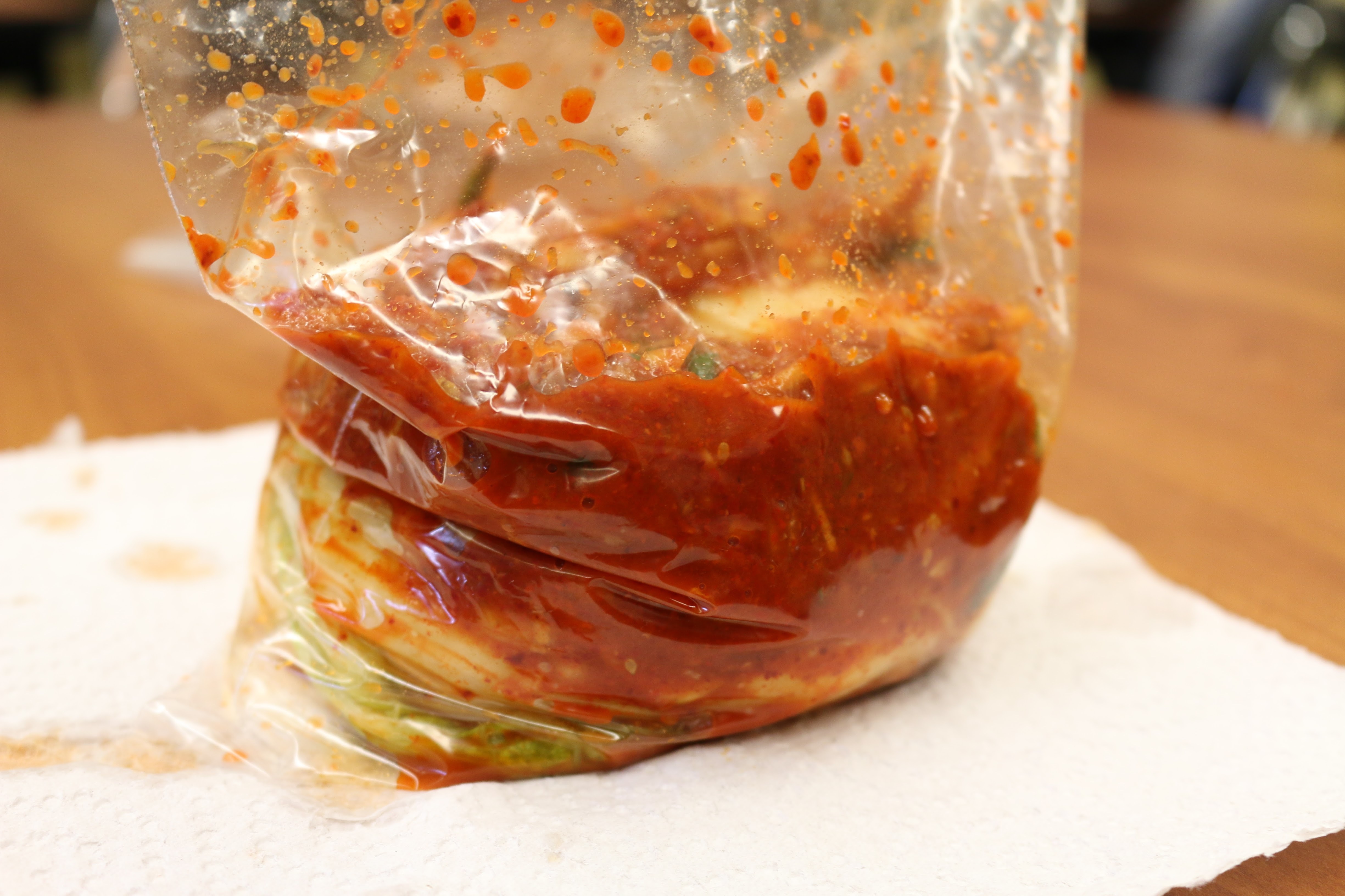 Once the napa cabbage is fully layered with seafood paste, store in a plastic container, removing all excess air, and place in the refrigerator.  Ferment to taste.