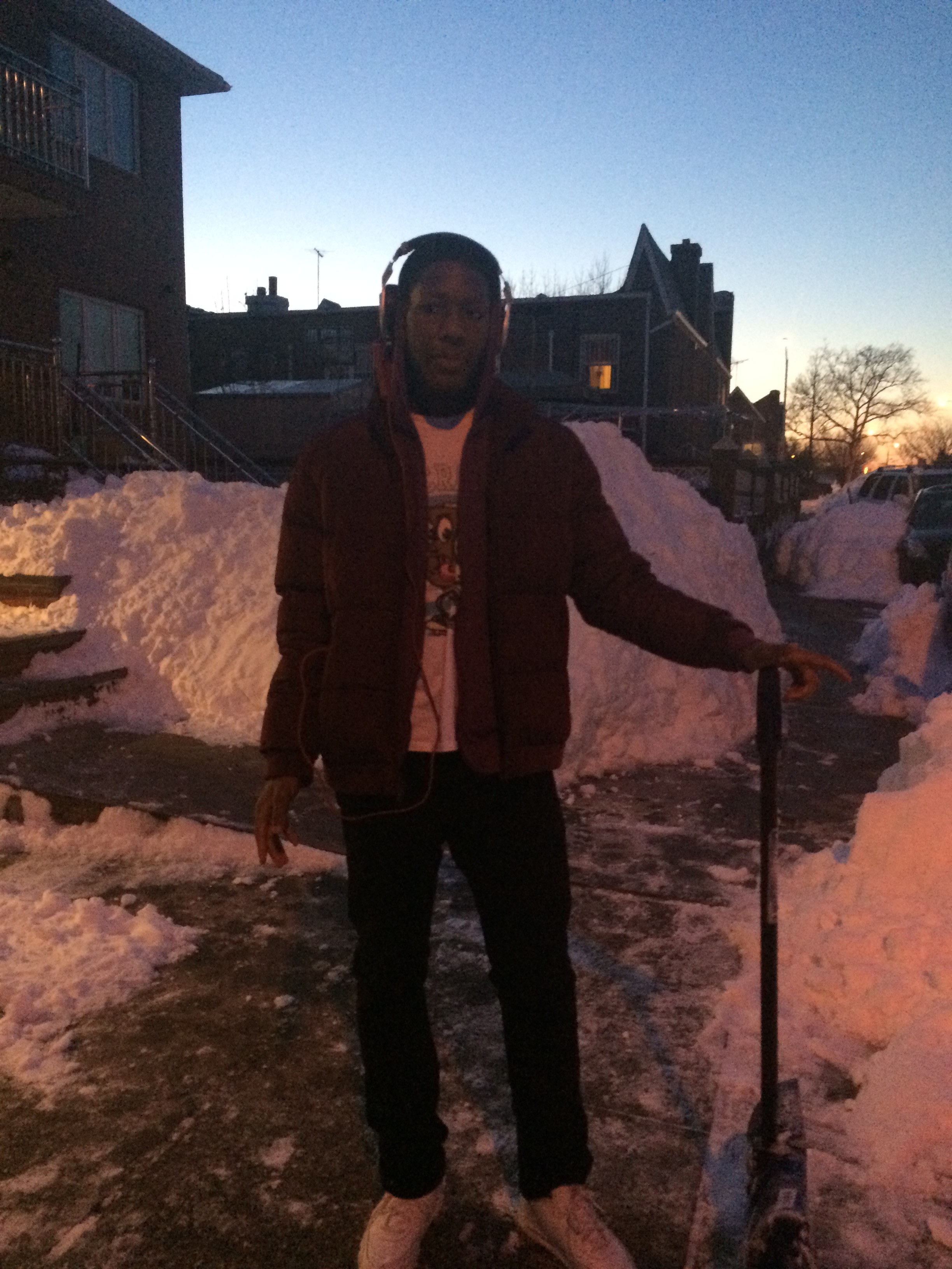 Omar Lawson taking a break after helping a UPS truck that got stuck in the snow.