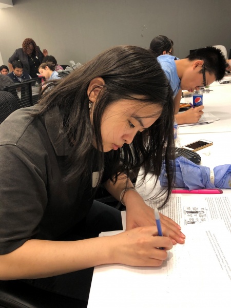 Jenny Qu and Alan Wang preparing for their debate.